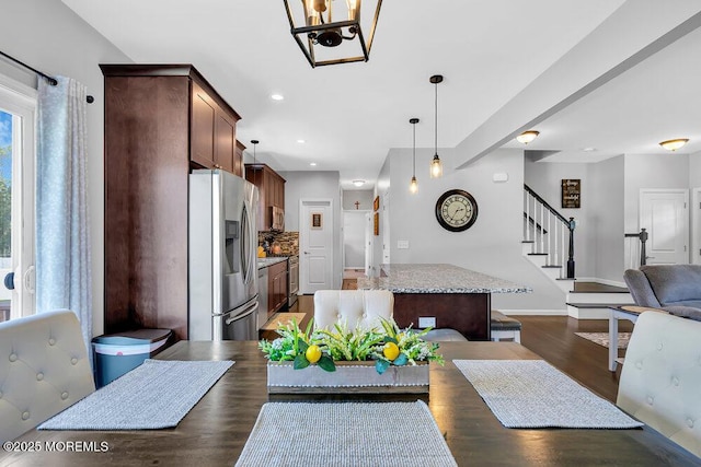 dining area with dark hardwood / wood-style floors