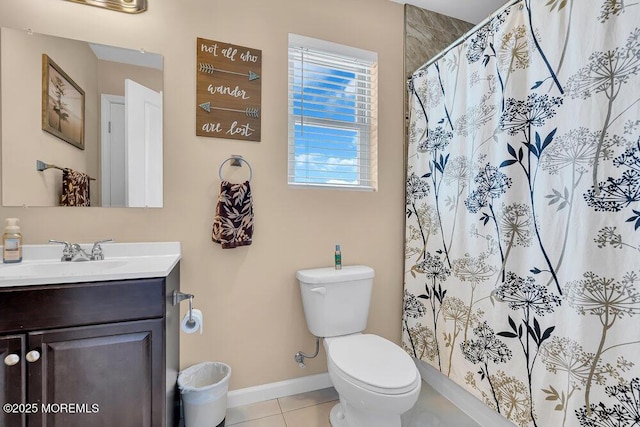 bathroom with vanity, tile patterned floors, toilet, and walk in shower