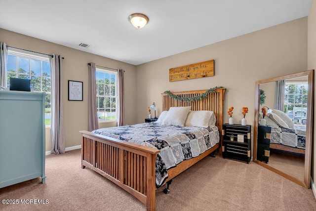 bedroom featuring light colored carpet