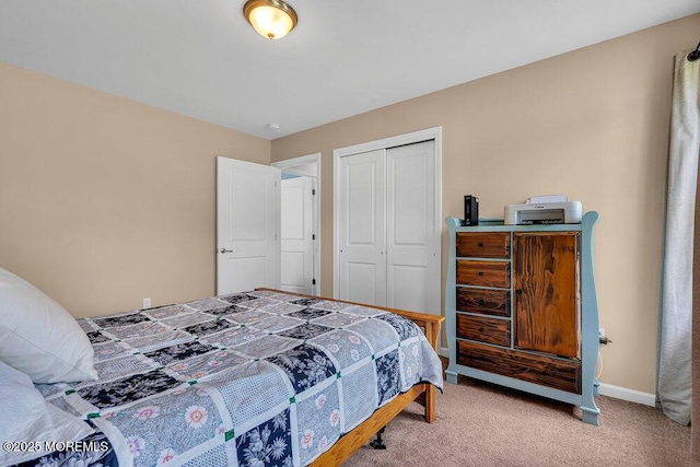 carpeted bedroom with a closet