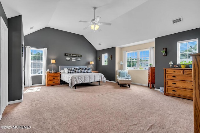 carpeted bedroom featuring ceiling fan and vaulted ceiling