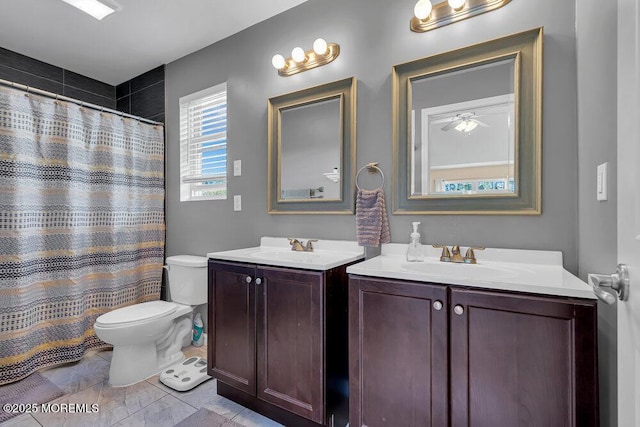 bathroom featuring vanity, walk in shower, and toilet