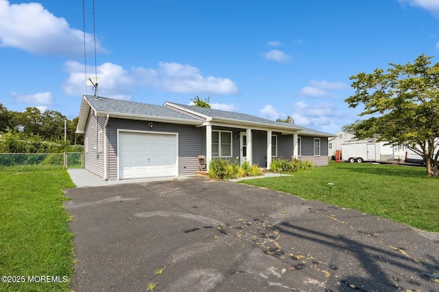 view of front of house featuring a garage and a front lawn