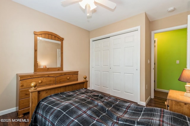 bedroom featuring dark hardwood / wood-style flooring, a closet, and ceiling fan