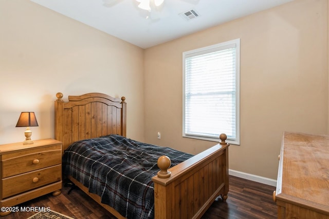 bedroom featuring ceiling fan and dark hardwood / wood-style flooring