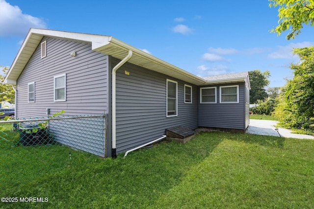 view of property exterior featuring a yard