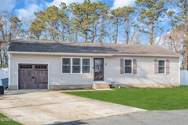 view of front facade with a garage and a front yard