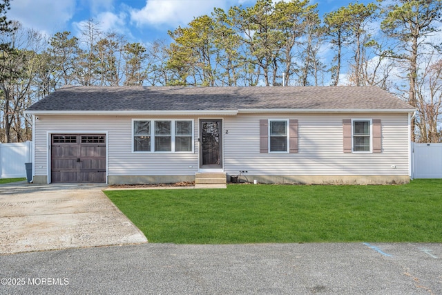 view of front facade with a garage and a front lawn