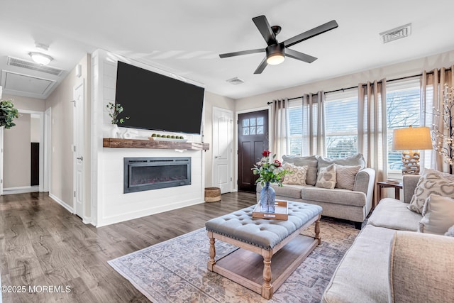 living room with hardwood / wood-style flooring and ceiling fan