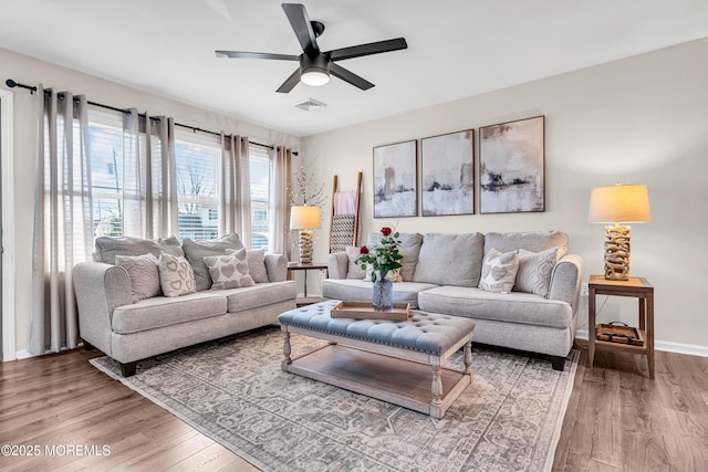 living room with ceiling fan and wood-type flooring