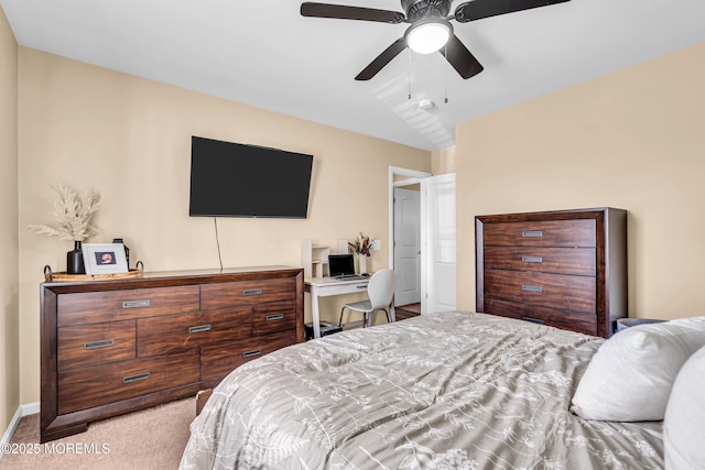 carpeted bedroom featuring lofted ceiling and ceiling fan