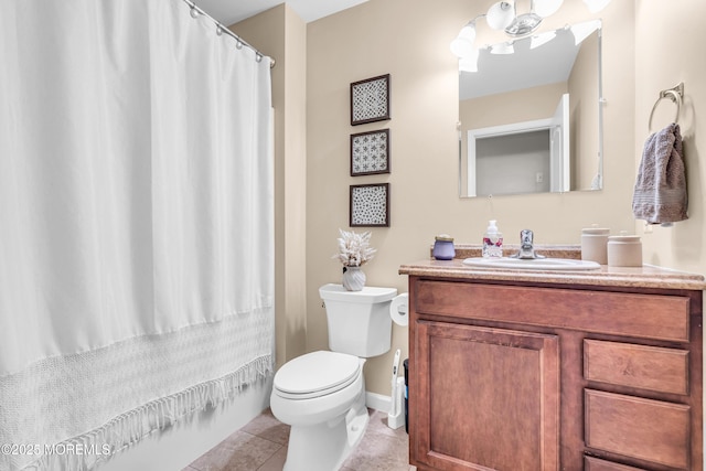 bathroom with vanity, tile patterned floors, and toilet