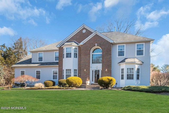 view of front of home with a front yard