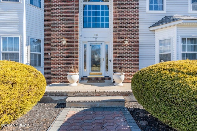 entrance to property with brick siding