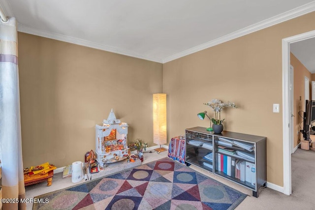 rec room with carpet flooring, crown molding, and baseboards