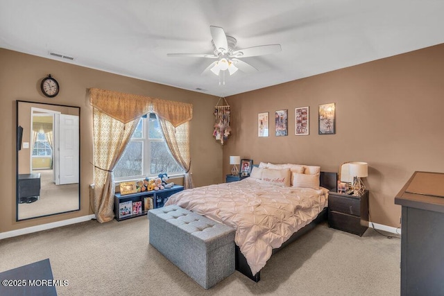 bedroom with a ceiling fan, light colored carpet, visible vents, and baseboards