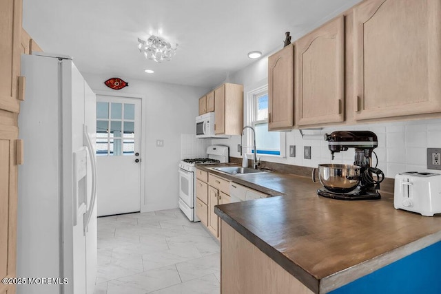 kitchen with white appliances, sink, decorative backsplash, and light brown cabinets