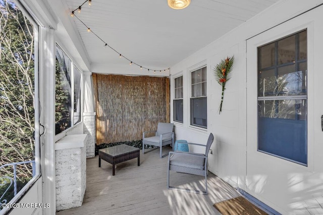 wooden terrace featuring covered porch