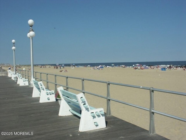 exterior space featuring a water view and a view of the beach