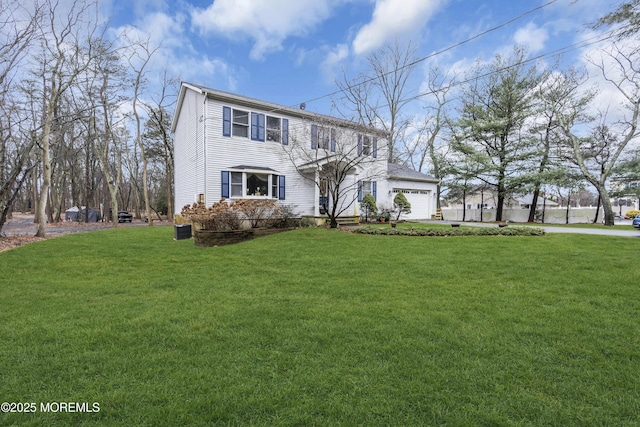 view of front of house featuring a garage and a front yard