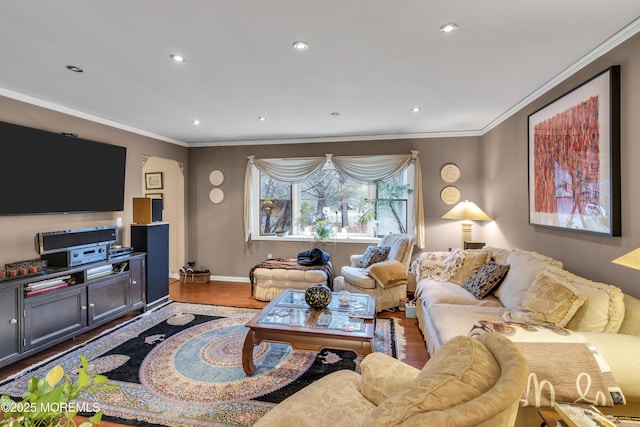 living room featuring crown molding and hardwood / wood-style floors