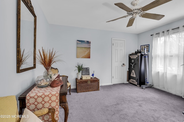 sitting room featuring carpet floors and ceiling fan