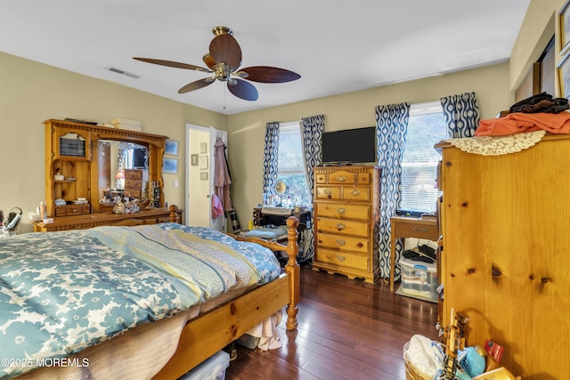 bedroom featuring ceiling fan and dark hardwood / wood-style floors