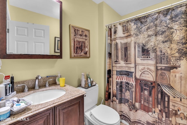 bathroom with vanity and toilet