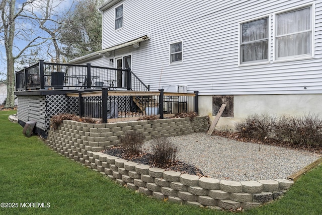 back of property featuring a yard and a deck