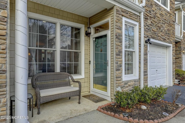 view of exterior entry featuring stone siding