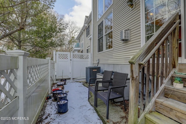 view of patio featuring cooling unit and a fenced backyard