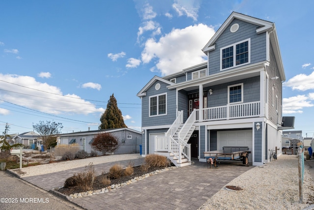 view of front of house with a garage and a porch