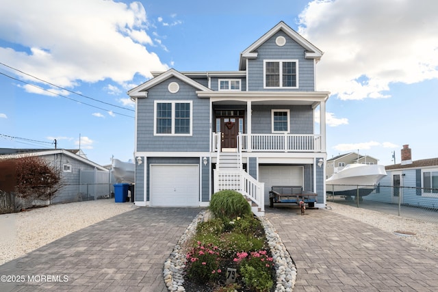 view of front of house featuring a garage and covered porch