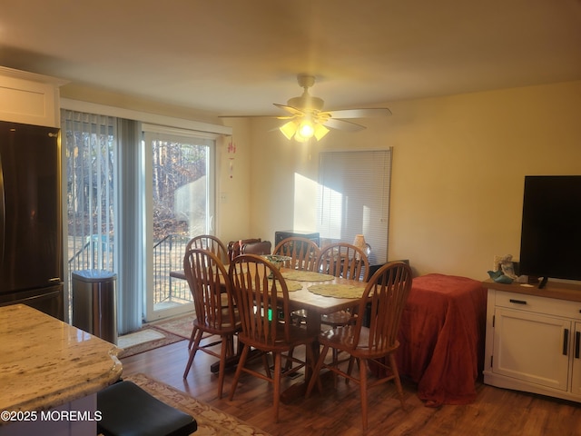 dining area featuring dark hardwood / wood-style floors and ceiling fan