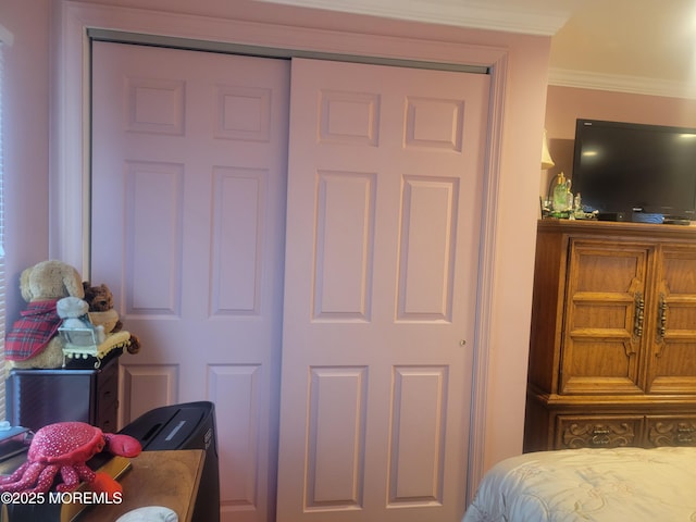 bedroom with ornamental molding