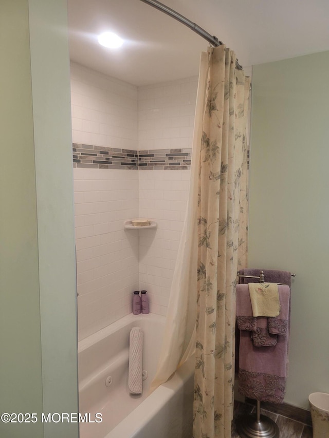 bathroom with shower / bath combination with curtain