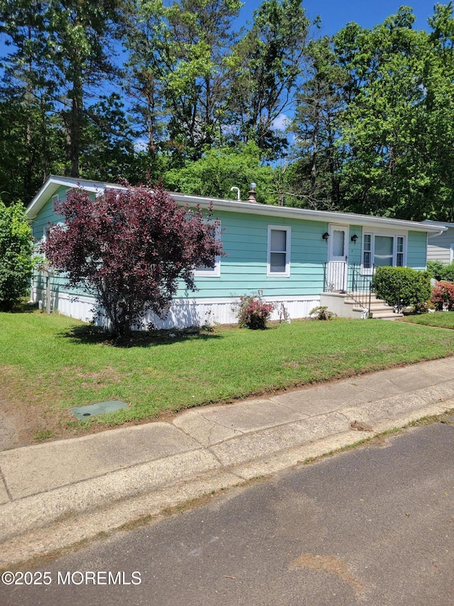 14 Douglas Dr, Jackson, NJ 08527 - manufactured / mobile home featuring a front yard