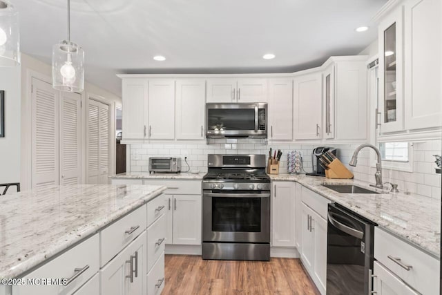 14 Douglas Dr, Jackson, NJ 08527 - kitchen with stainless steel appliances, white cabinets, backsplash, recessed lighting, and glass insert cabinets