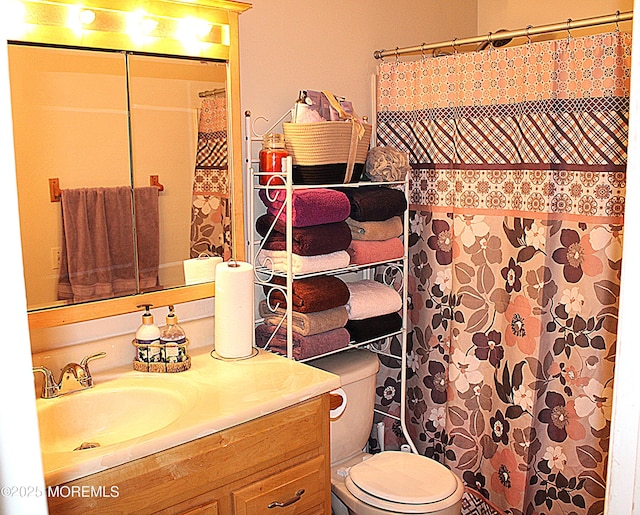 bathroom with vanity and toilet