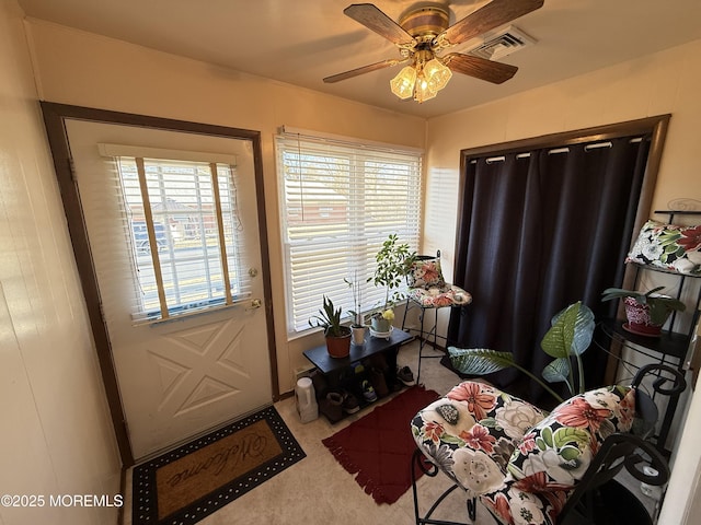 interior space with a healthy amount of sunlight and ceiling fan