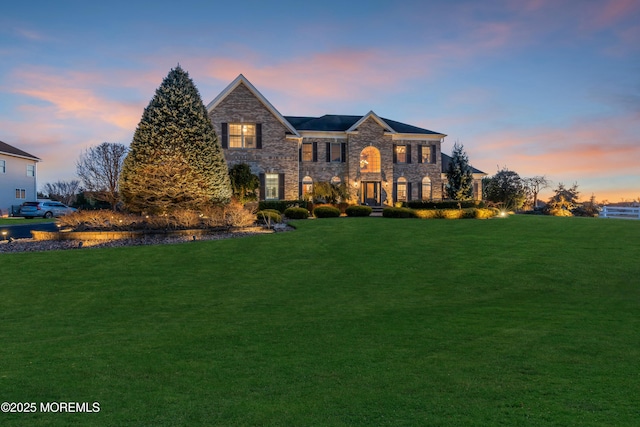 view of front of house with a lawn