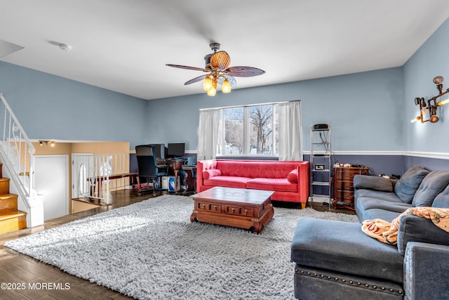 living room with ceiling fan and hardwood / wood-style floors