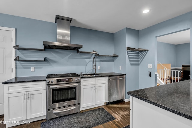 kitchen featuring sink, dark wood-type flooring, white cabinetry, stainless steel appliances, and exhaust hood