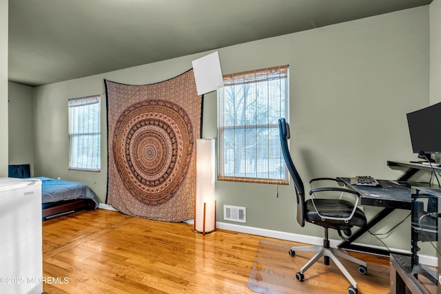 bedroom with light hardwood / wood-style flooring