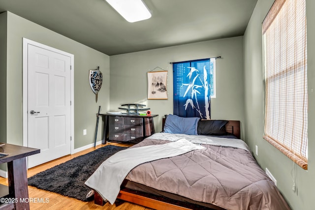 bedroom with hardwood / wood-style flooring