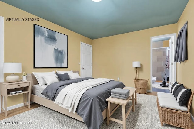 bedroom featuring wood-type flooring