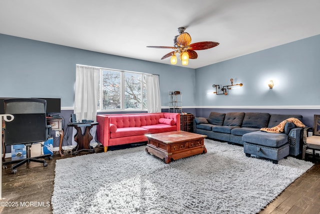 living room with dark wood-type flooring and ceiling fan