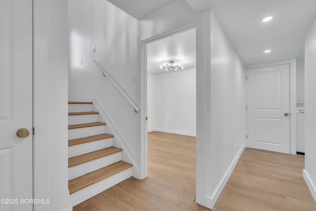 stairway with recessed lighting, wood finished floors, and baseboards