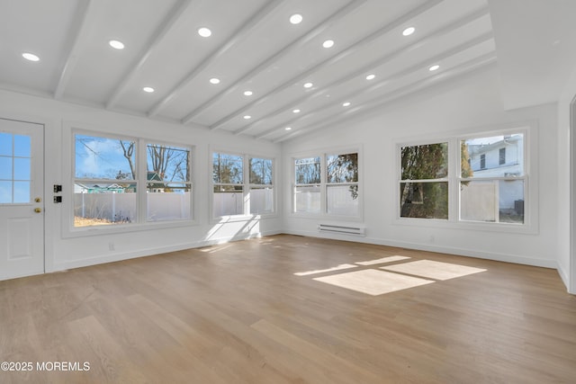 unfurnished sunroom featuring a baseboard heating unit and vaulted ceiling with beams