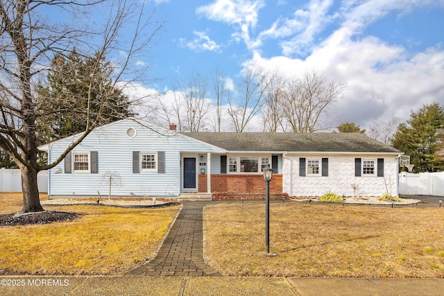 ranch-style house with a front yard